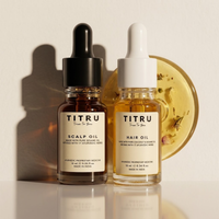 Titru Scalp Oil and Titru Hair Oil mini dropper bottles side by side