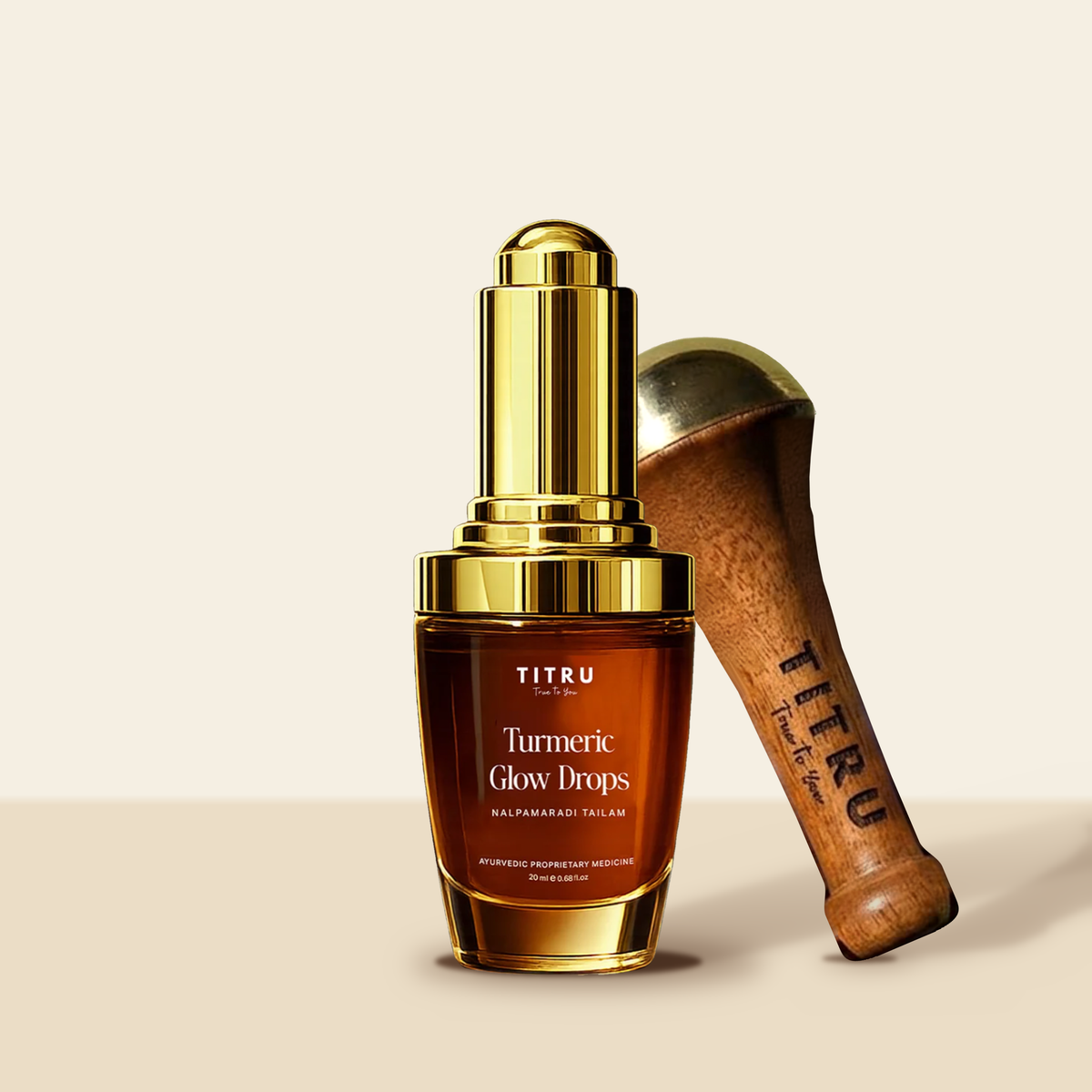Titru Turmeric Glow Drops bottle with a bronze Kansa wand on a teak handle